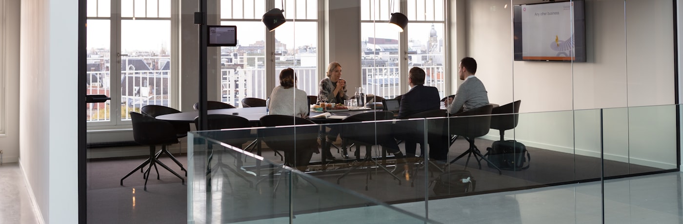 Business leaders meeting around a table at a local chamber of commerce
