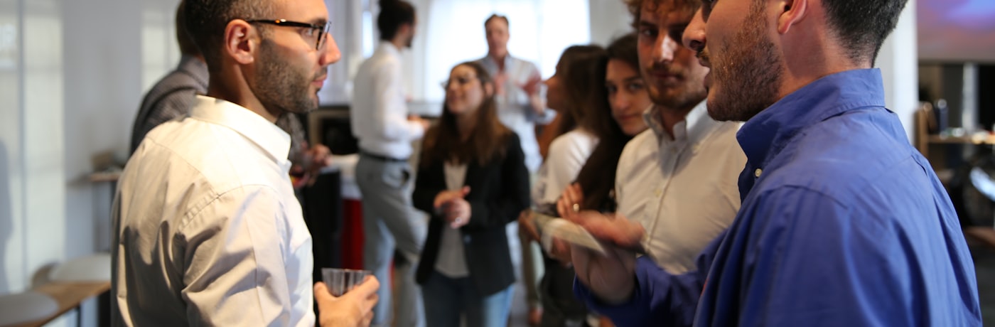Members talking at a World Trade Society gathering